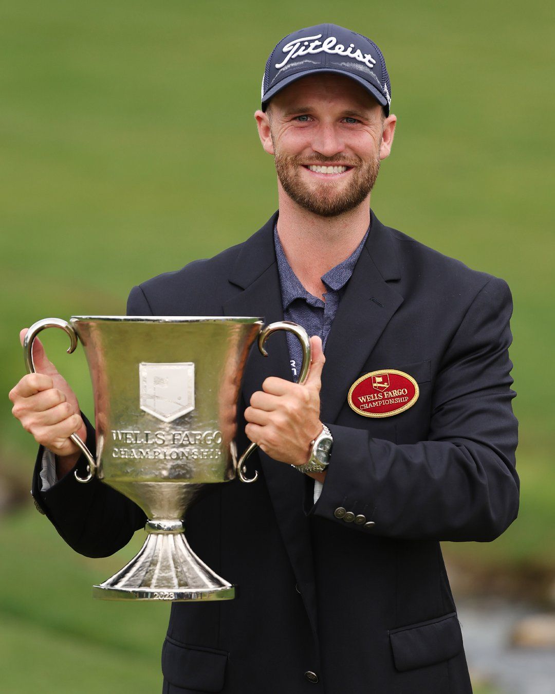 Wells Fargo Championship winner Wyndham Clark holding trophy made by